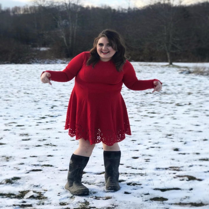 A different reviewer wearing the dress in red