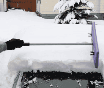Gif of the wide, flat foam side sliding big chunks of snow off the top of a car