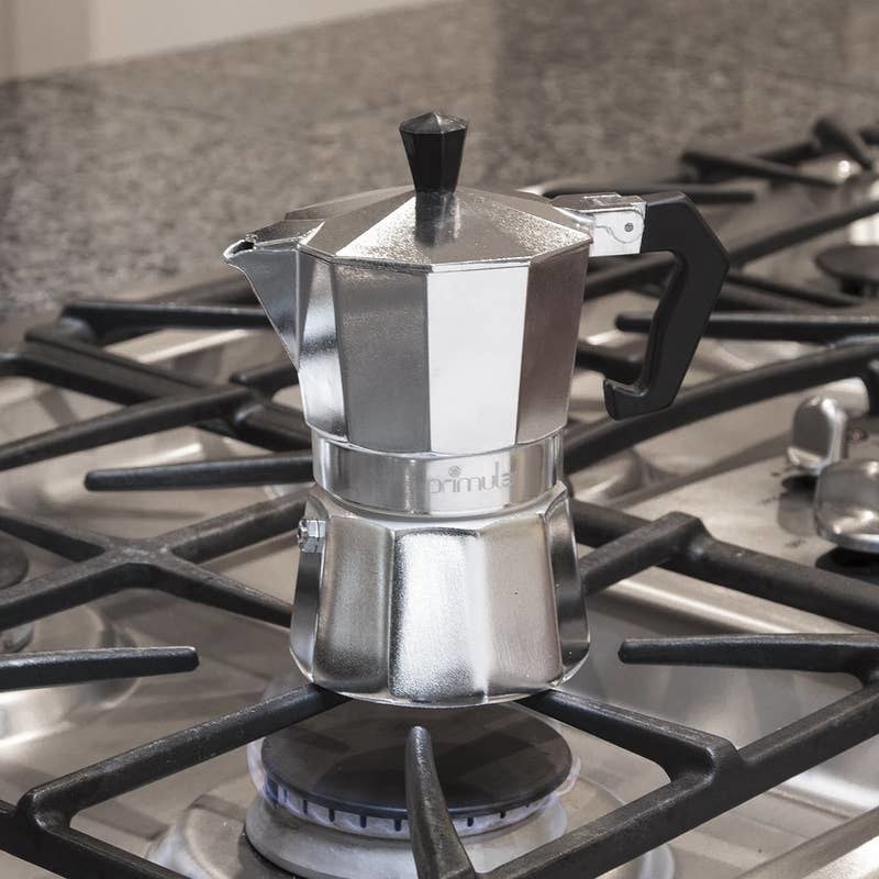 silver espresso moka pot on a stovetop