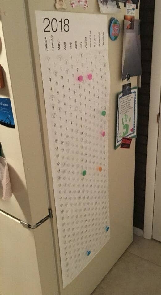 Reviewer photo of the calendar stuck to the side of a fridge