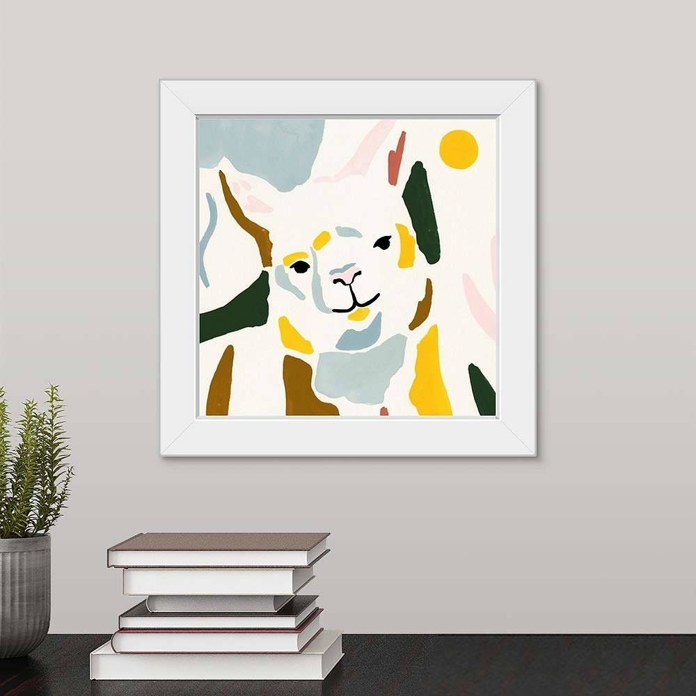 The square print illustration of a llama with color patches of blue, green, yellow, and brown