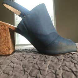 Blue heel with water stain at foot 