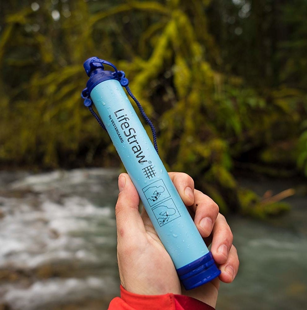 A person holding the LifeStraw