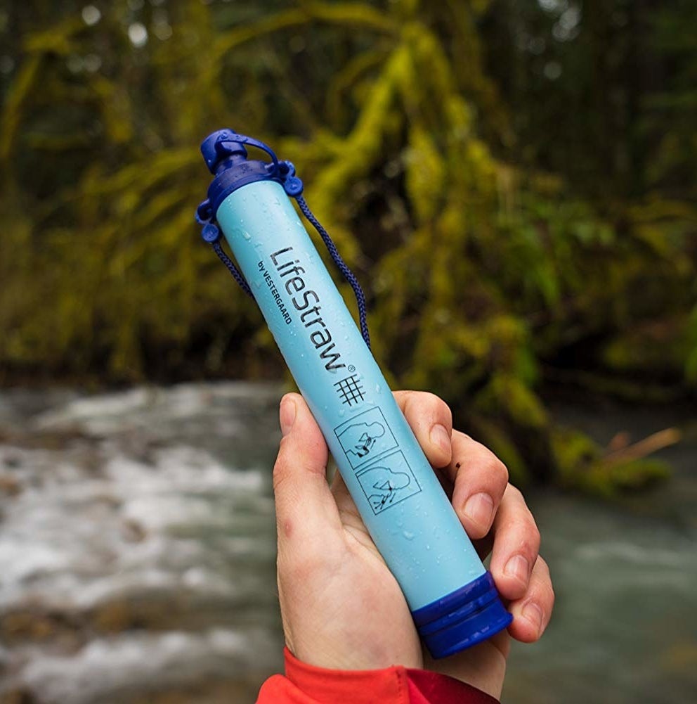 A person holding the LifeStraw