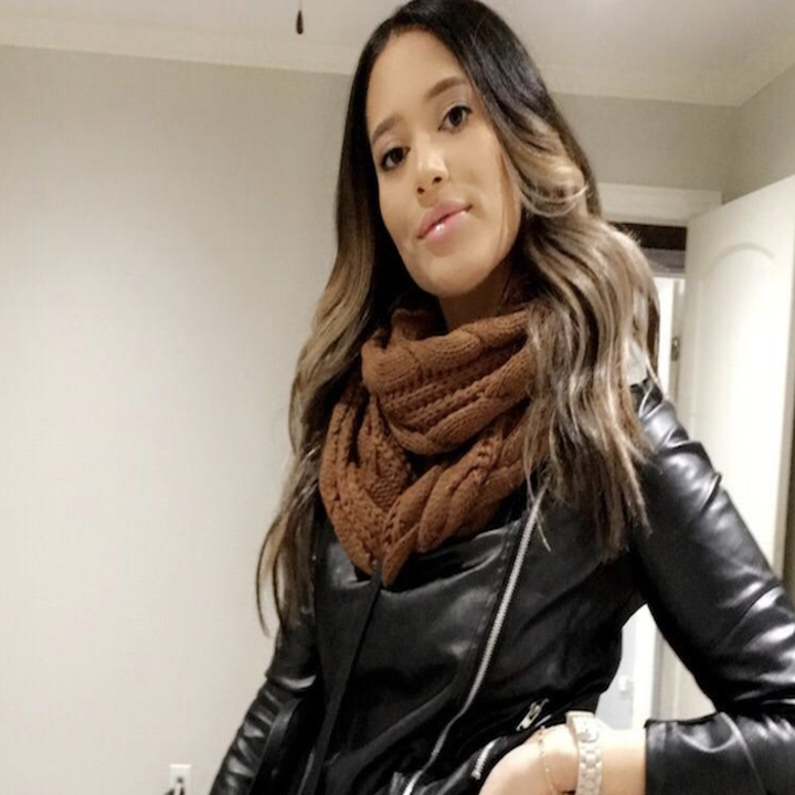 another reviewer wearing the brown scarf with a leather moto jacket
