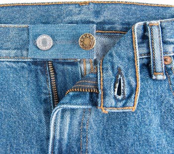 The blue denim one fastened to the waistband of a pair of jeans