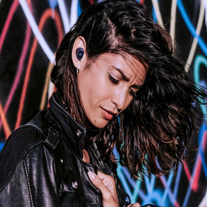 A person wearing the earbuds