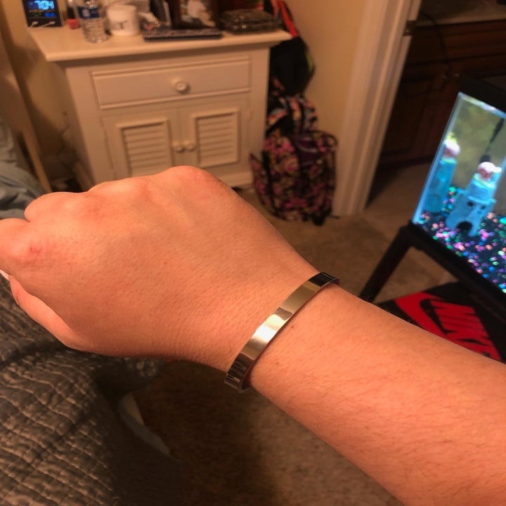 reviewer wearing the silver cuff