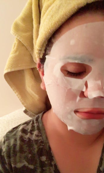 reviewer wearing one of the face masks 