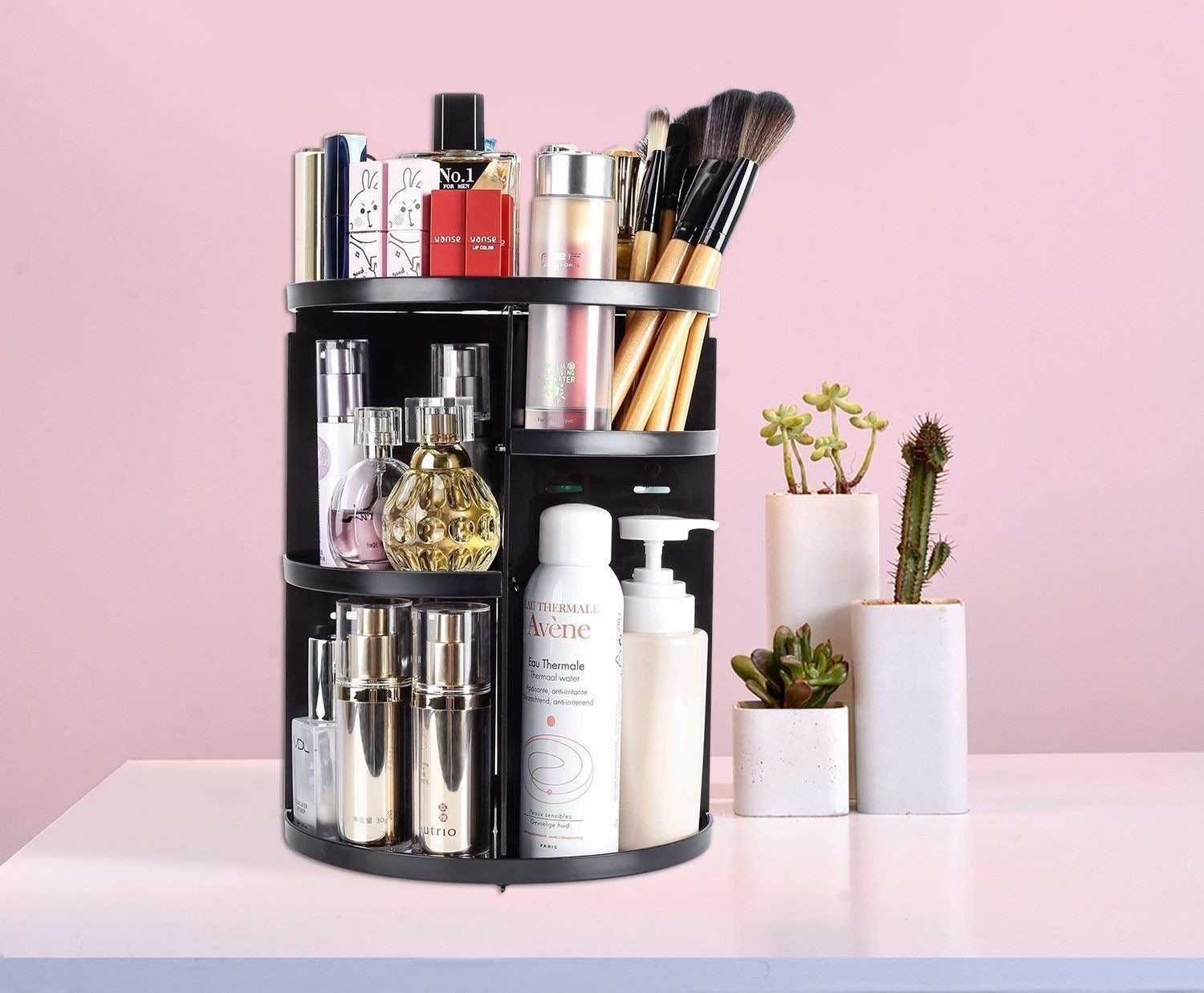 A large cylinder-shaped rack with tons of beauty products stacked on the shelves