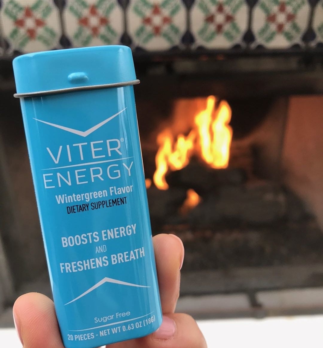 hand holding small tin of 20 Viter Energy mints