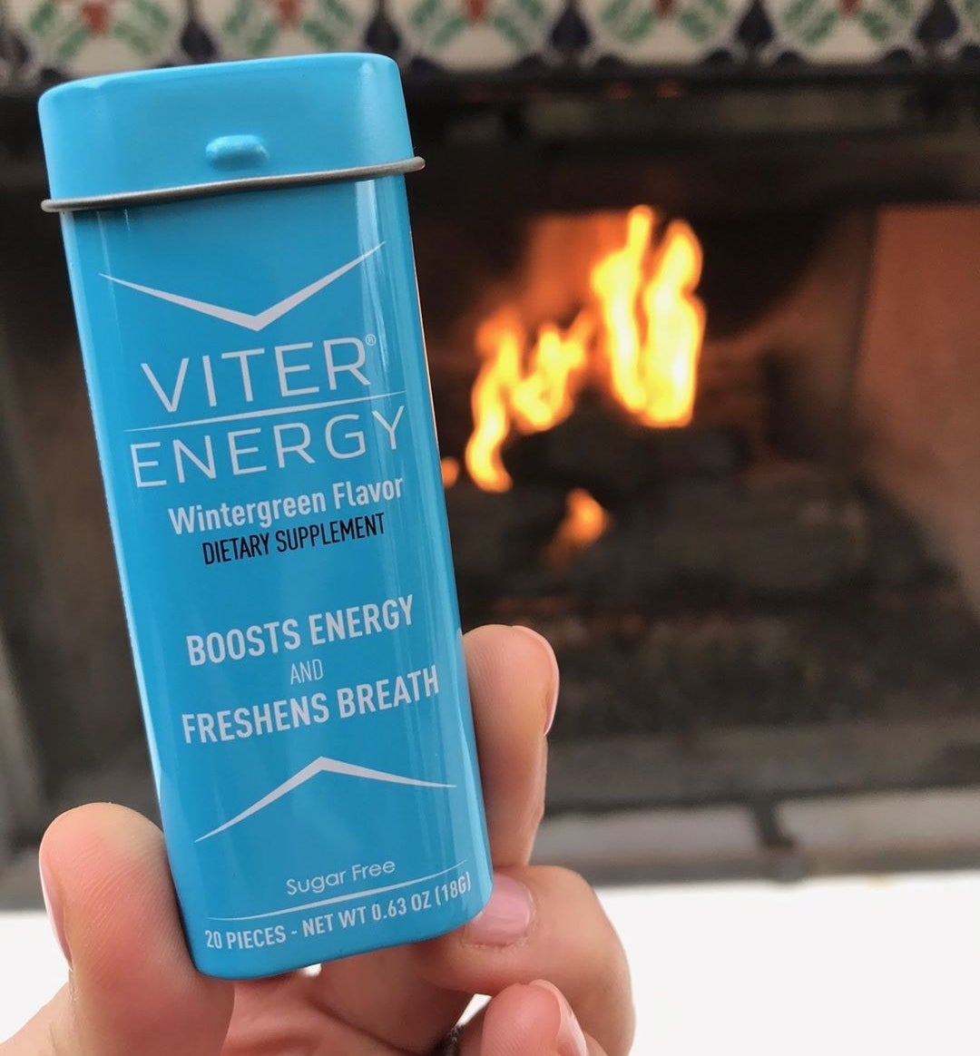 hand holding small tin of 20 Viter Energy mints