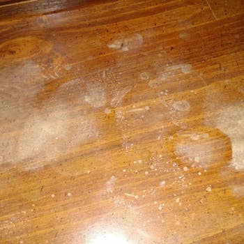 A wooden table with mysterious discoloration. 