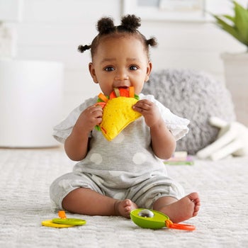 Baby with teething toy