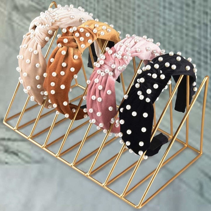the velvet headbands in pink, black, brown, and cream 