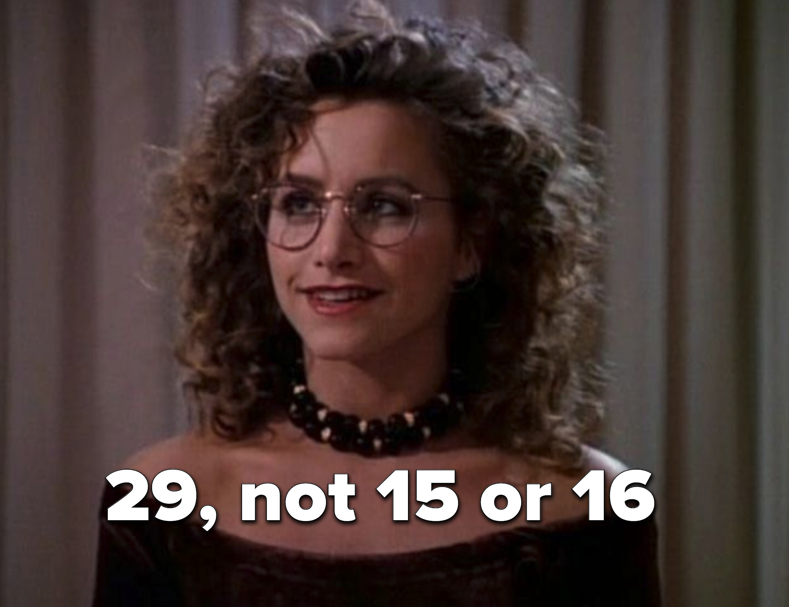 Andrea Zuckerman with a perm and &#x27;90s glasses