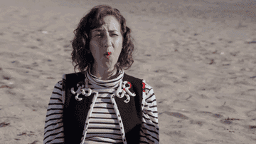gif of kristin schaal in &quot;last man on earth&quot; mouthing &quot;oh wow&quot;
