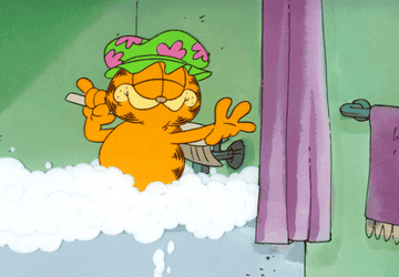 Garfield looking relaxed and content in the bath
