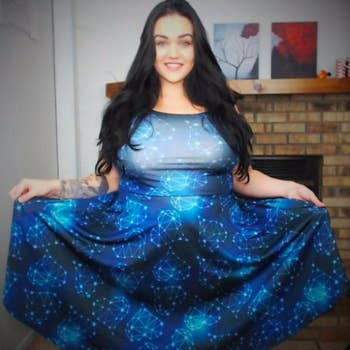 A reviewer wearing the constellation print sleeveless dress