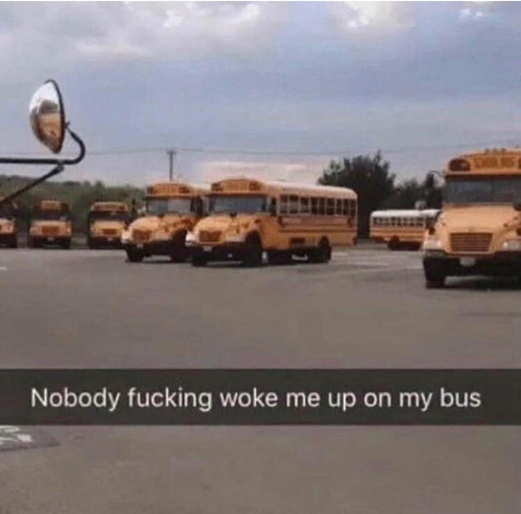 A parking lot full of buses