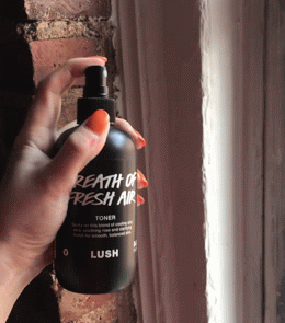 gif of a hand and the toner spraying from its bottle