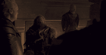 Game of Thrones gif in which a character is chugging some liquid while others in the room look on uncomfortably. The caption reads &quot;(glug, glug, glug, gulg, glug...)&quot;