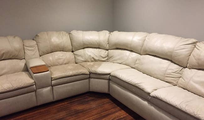 Reviewer's couch with one side cleaned with wood polishing cleaner