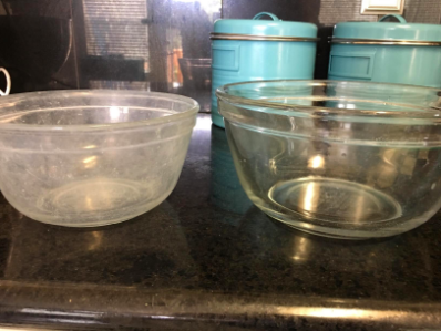 reviewer pic of cloudy pyrex bowl then completely clear, clean looking bowl