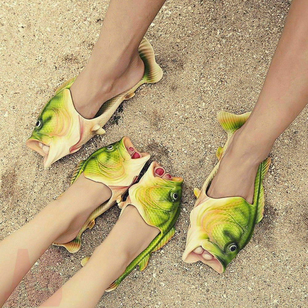 Two people wearing fish slides at the beach