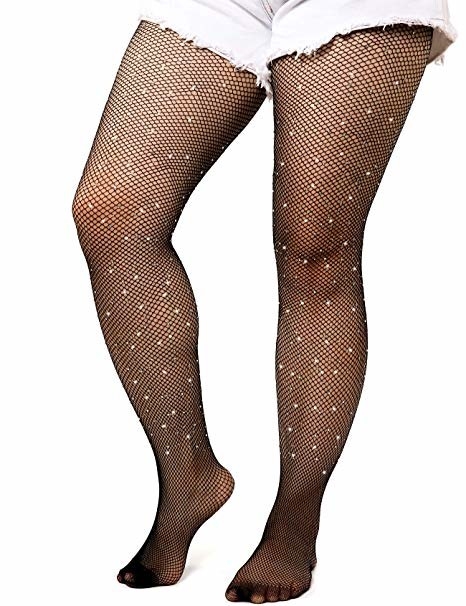 model wearing black fishnet tights with rhinestones on them under white cutoff shorts