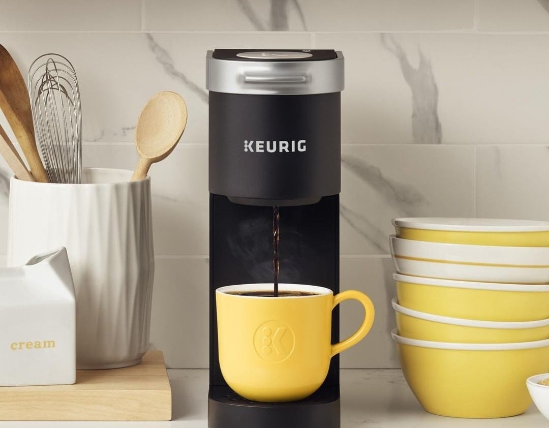 The Keurig pouring coffee into a mug