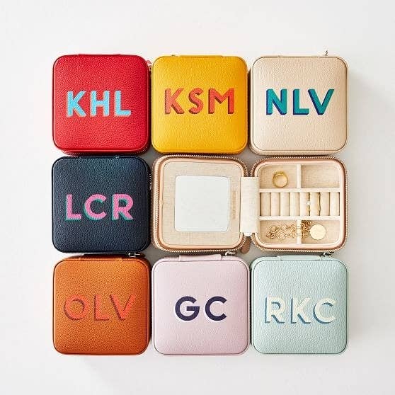 small jewelry zip around travel cases with customized block letter initials on each one