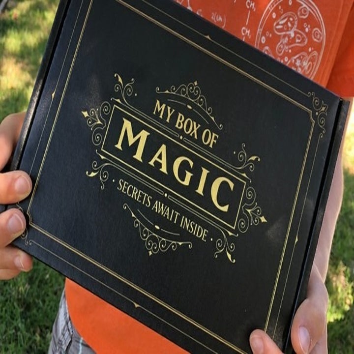 Hands holding up the box of magic 