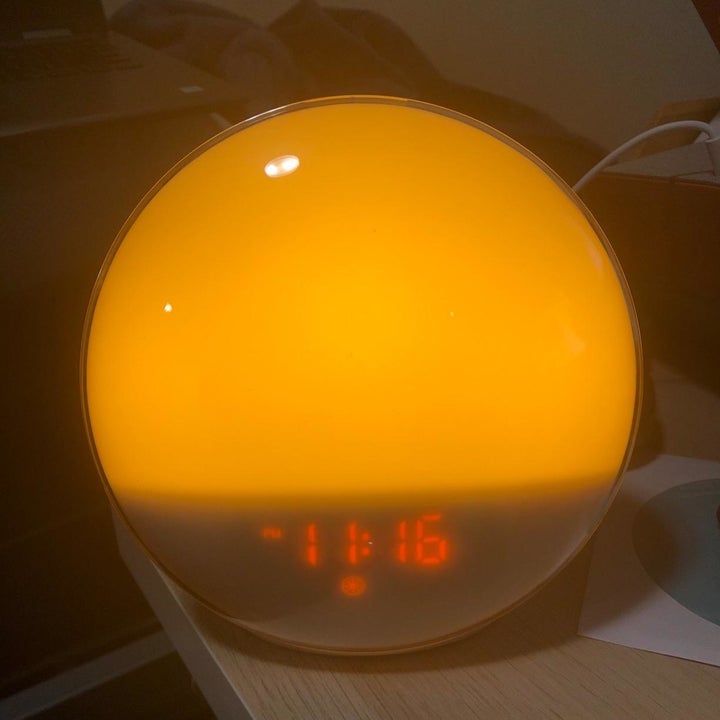 A reviewer's alarm clock glowing an orange color