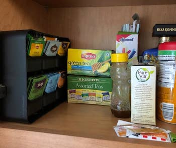 reviewer of the same kitchen cabinet with the tea bag organizer