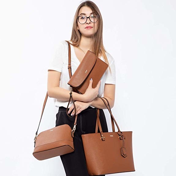 model holding all three kinds of purses