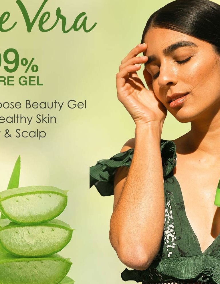 A person holding the aloe vera gel bottle.