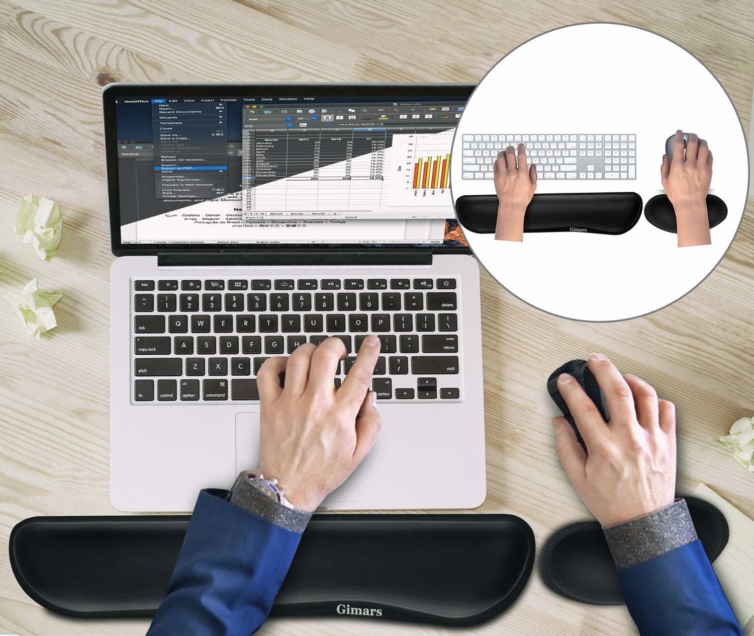 hands typing and using a mouse while resting on the wrist cushions 