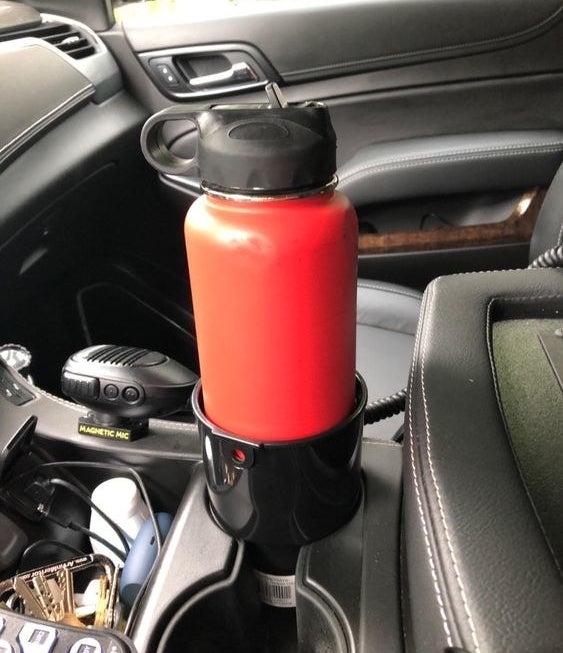 A reviewer&#x27;s bottle in the extended cup holder