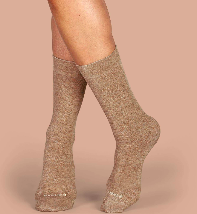 a model wearing the blush-colored socks