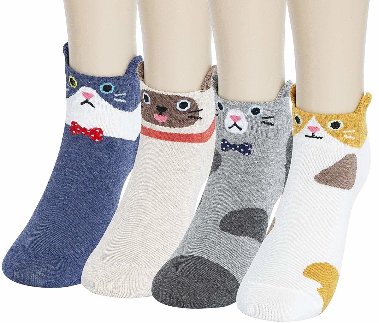 The four pairs of socks each with a different cat pattern and face with ears on the sides