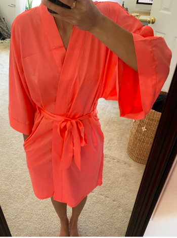 Reviewer wearing the robe in coral