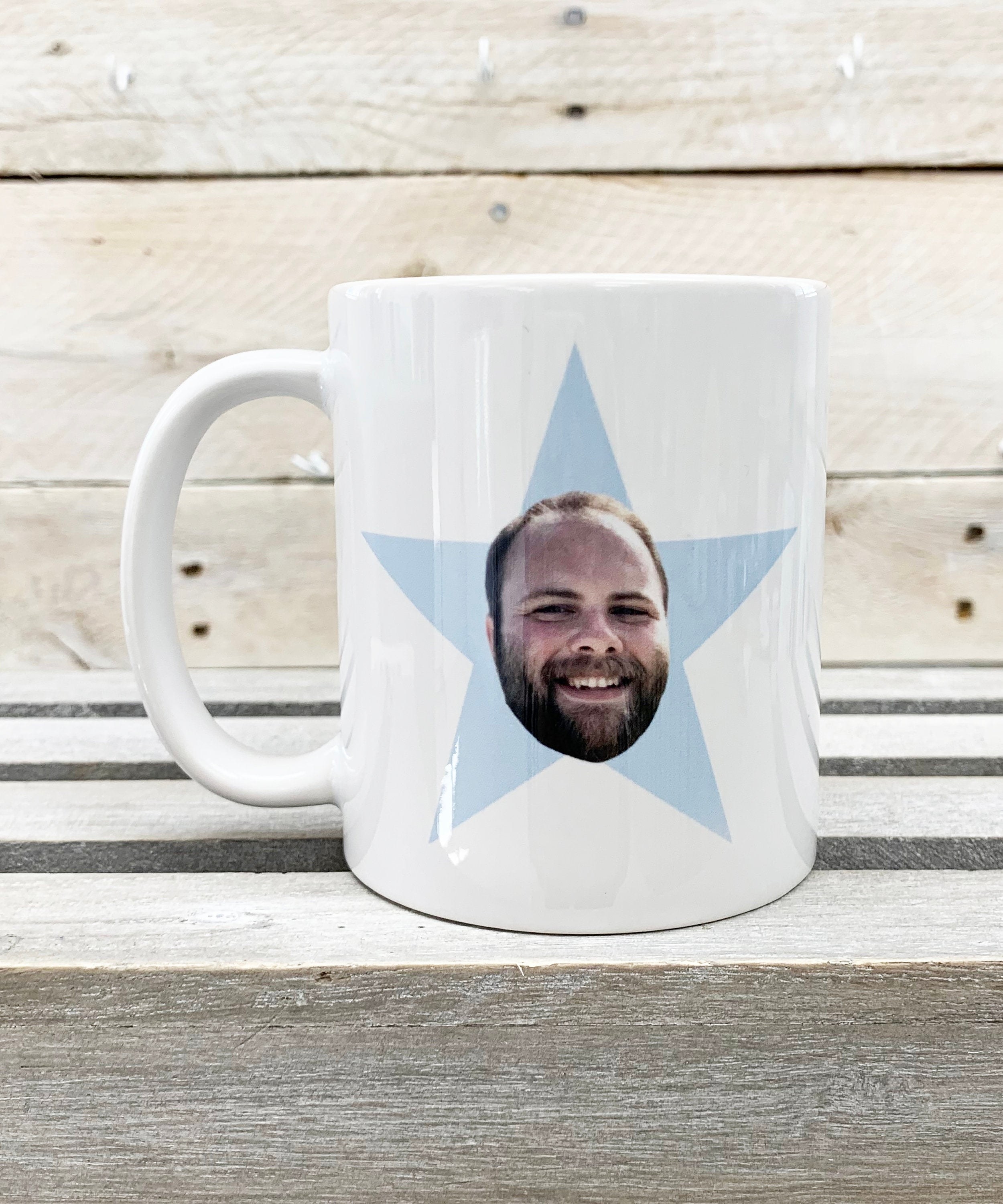 mug with light blue star with face photoshopped on it 