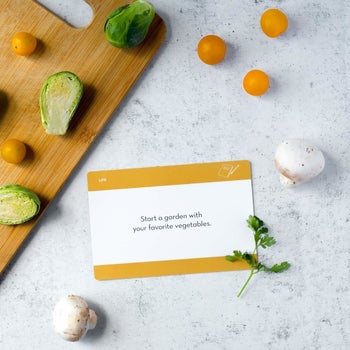 a card that says start a garden with your favorite vegetables 
