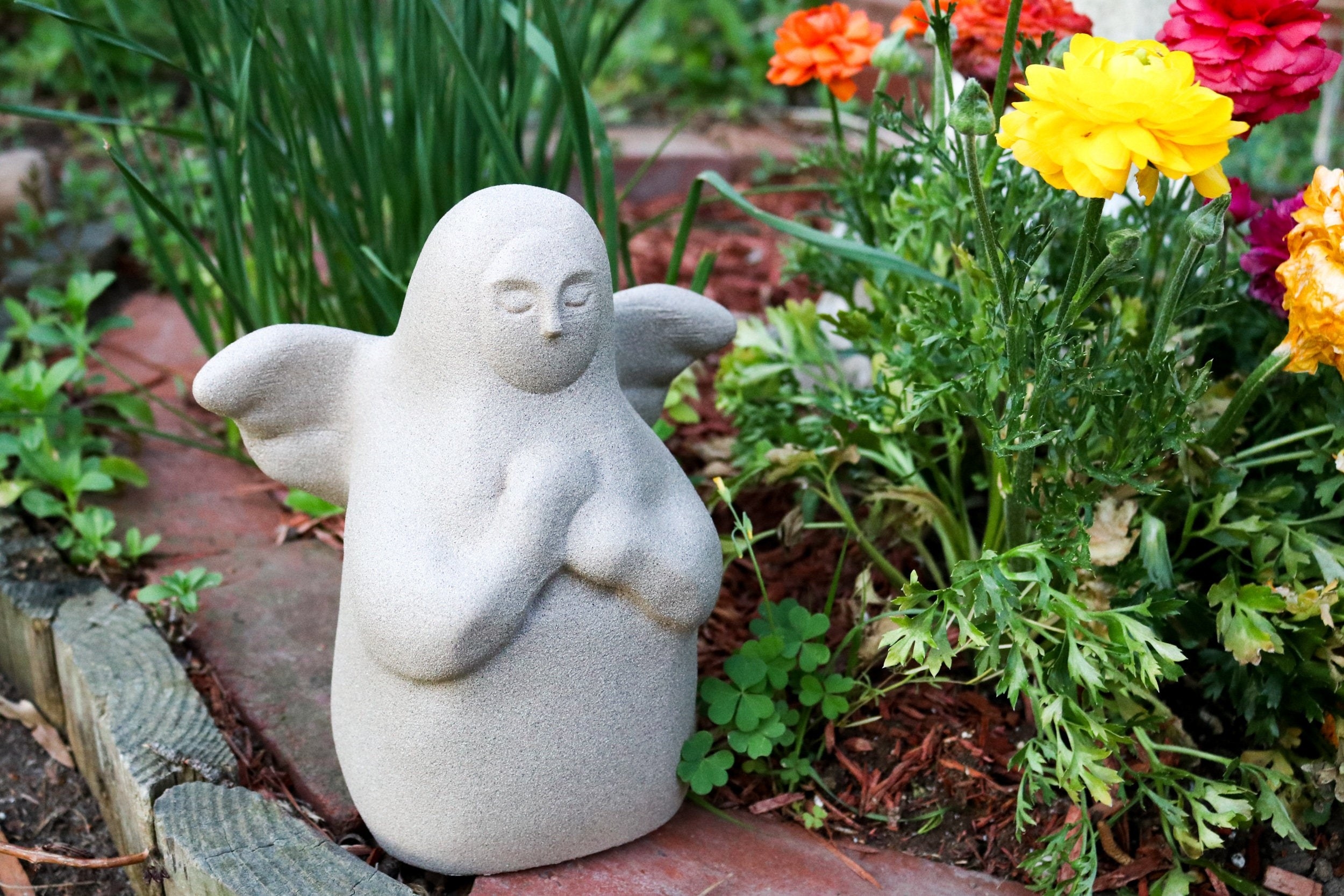 statue shaped like praying angel from video game 