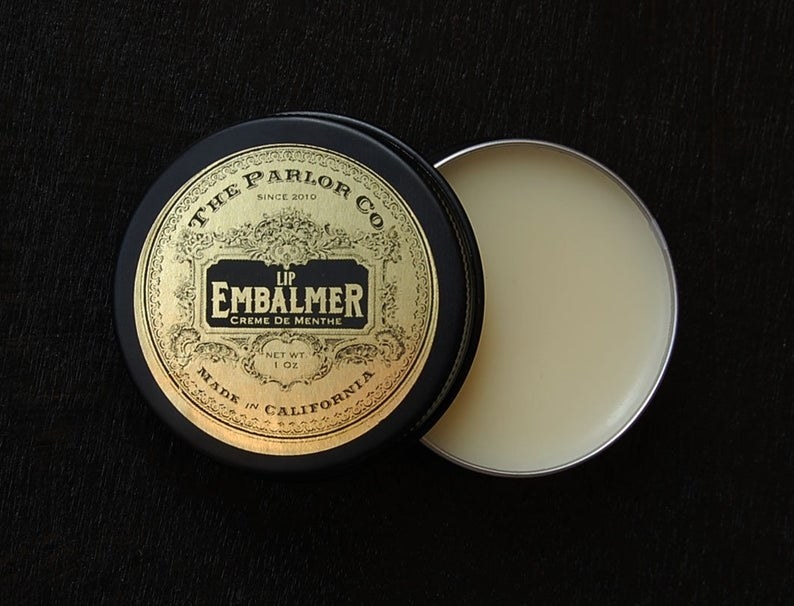 small labeled tin of lip balm 