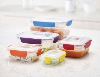 the containers and lids in different sizes with food inside