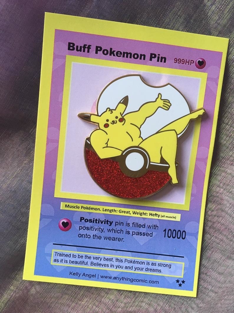 Enamel pin of a buff Pikachu sitting in a poke ball and the packaging looks like a Pokemon card