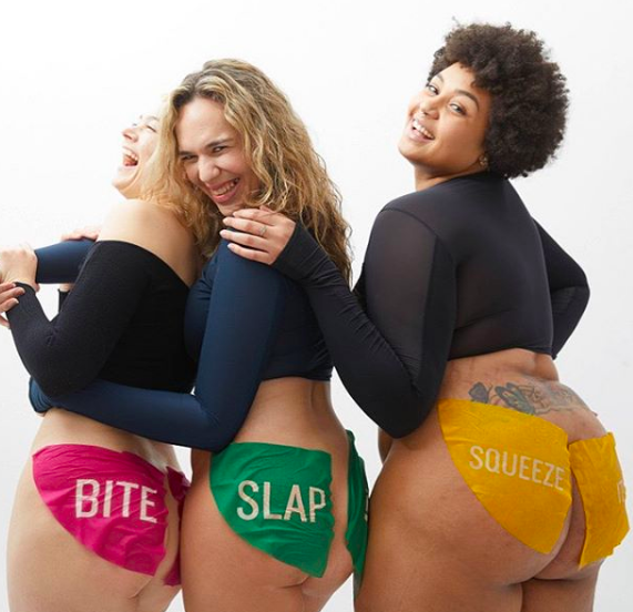 Three models with the Bite, Slap, and Squeeze masks on each backside cheek 