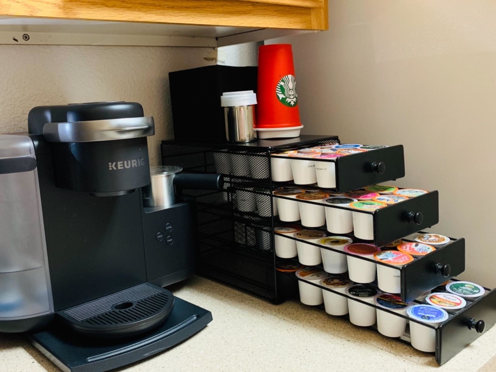 the four tier drawer displaying a massive collection of coffee pods